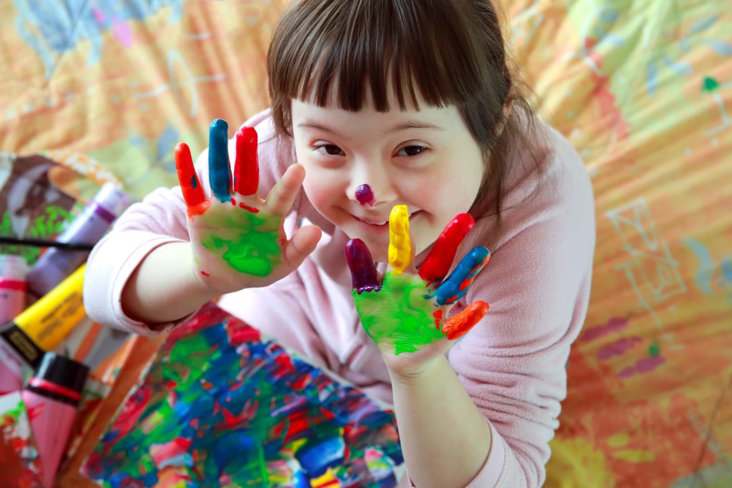 Cute little girl with painted hands By denys_kuvaiev